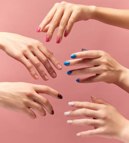 Soft skin. Beautiful female hands with different manicure, nail colors against pink background. Taking care. Concept of hand care, cosmetics and cosmetology, spa, natural beauty. Poster, ad